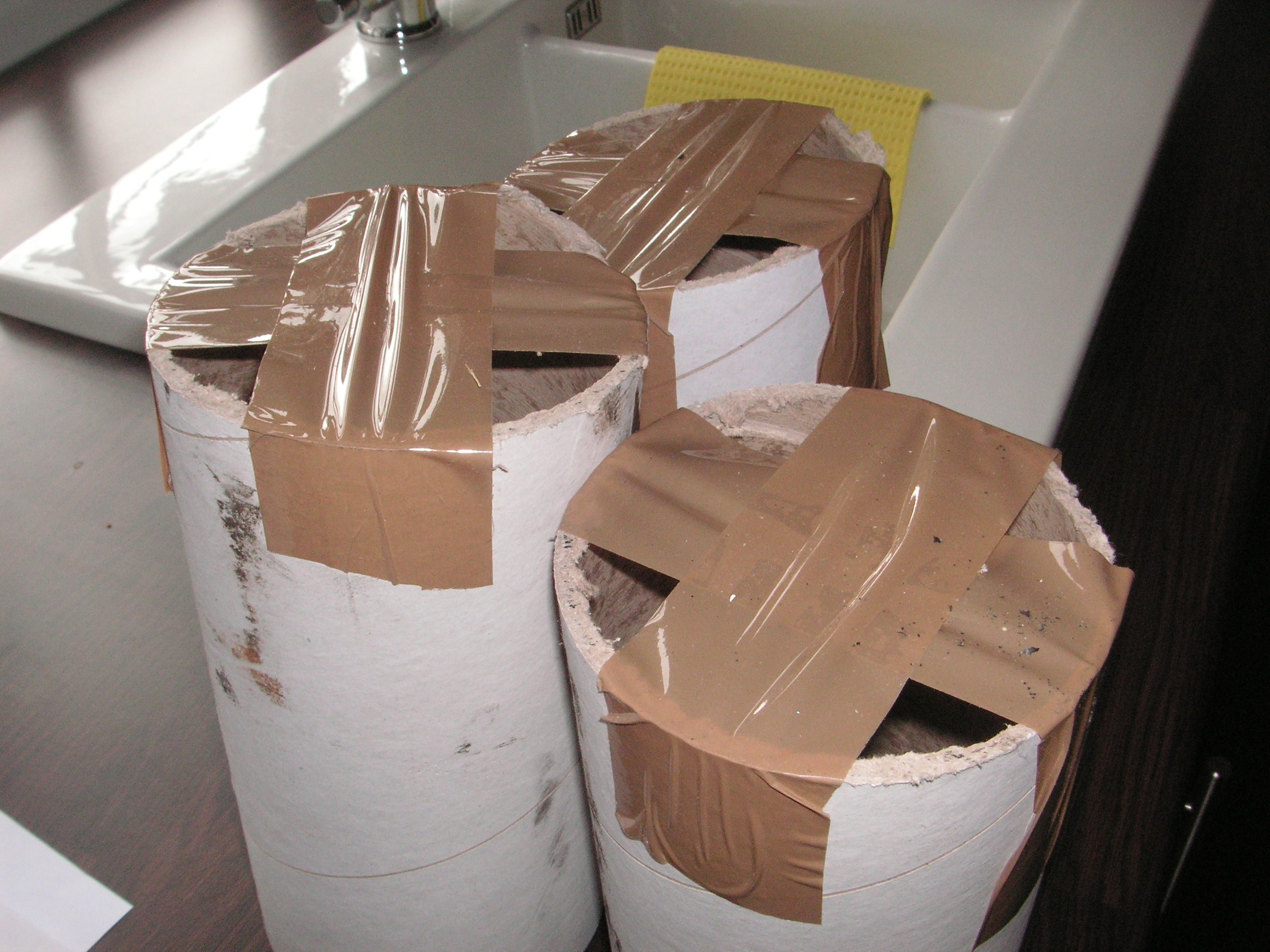 Cut lengths of carpet tube with one end sealed with packing tape